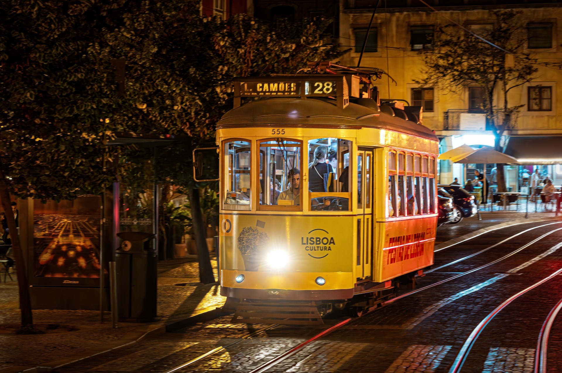 A vintage number 28 Tram, travelling through the Alfama district in Lisbon, Portugal.